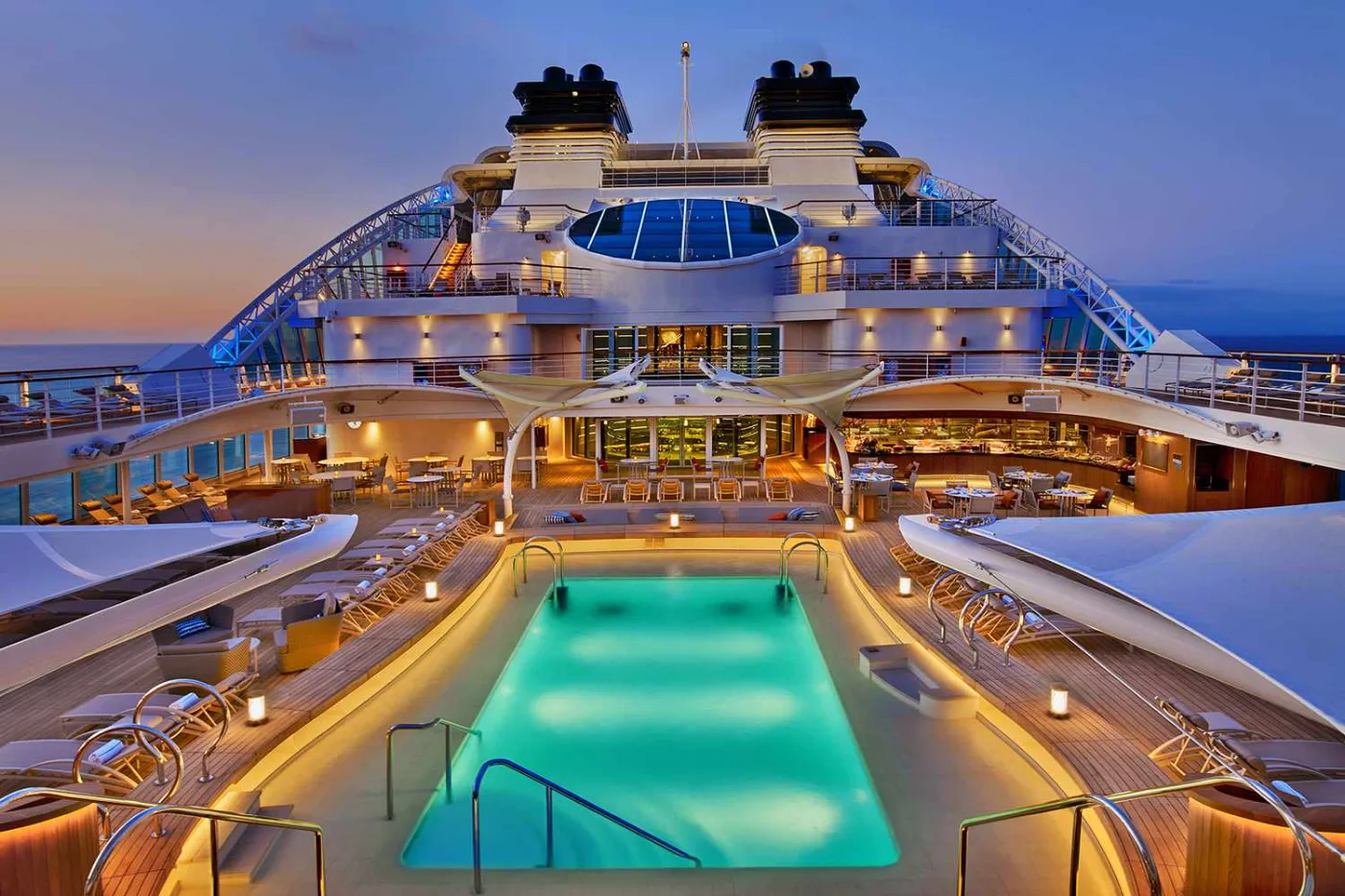 Pool deck of a luxury cruise ship at dusk