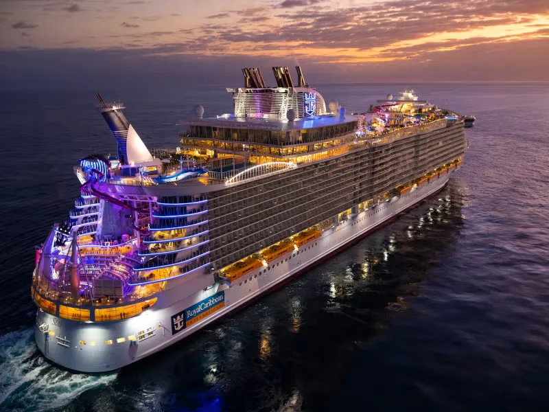 Cruise ship lit up at dusk